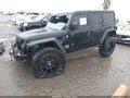 2020 Jeep Wrangler Unlimited — photo 2 of 16 | VIN 1C4HJXDG5LW207002