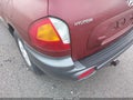 2004 Hyundai Santa Fe — photo 12 of 13 | VIN KM8SC73D34U747058