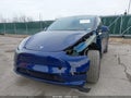 2023 Tesla Model Y — photo 2 of 20 | VIN 7SAYGAEE1PF909534