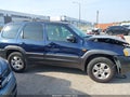 2003 Mazda Tribute — photo 12 of 12 | VIN 4F2CZ06113KM16277