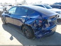 2022 Tesla Model Y — photo 3 of 18 | VIN 7SAYGDEF2NF330172