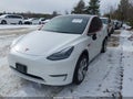 2024 Tesla Model Y — photo 2 of 18 | VIN 7SAYGDEEXRA290434