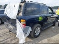 2004 Chevrolet Tahoe — photo 4 of 11 | VIN 1GNEC13Z34J199100
