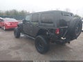 2014 Jeep Wrangler Unlimited — photo 3 of 18 | VIN 1C4BJWDG1EL298628