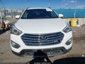 2016 Hyundai Santa Fe — photo 12 of 16 | VIN KM8SM4HFXGU135014