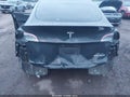 2023 Tesla Model Y — photo 6 of 18 | VIN 7SAYGDEE6PA190845