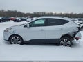 2015 Hyundai Tucson — photo 14 of 16 | VIN KM8JUCAG0FU025855