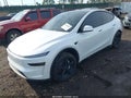 2026 Tesla Model Y — photo 2 of 20 | VIN 7SAYGDEDXTA438614