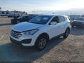 2016 Hyundai Santa Fe — photo 2 of 16 | VIN 5XYZTDLB9GG305892