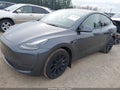 2023 Tesla Model Y — photo 2 of 21 | VIN 7SAYGAEE4PF934539