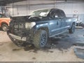 2014 Toyota Tundra — photo 2 of 16 | VIN 5TFCY5F16EX016057