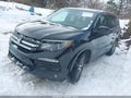 2018 Honda Pilot — photo 2 of 16 | VIN 5FNYF5H39JB017900