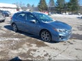 2018 Subaru Impreza — photo 1 of 16 | VIN 4S3GTAU69J3725123