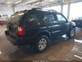 2003 Isuzu Rodeo — photo 4 of 12 | VIN 4S2DM58W534313137
