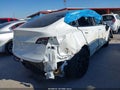 2023 Tesla Model Y — photo 4 of 9 | VIN 7SAYGDEE6PA199478