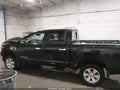 2017 Nissan Titan — photo 14 of 16 | VIN 1N6AA1E5XHN571194