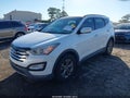 2014 Hyundai Santa Fe — photo 2 of 17 | VIN 5XYZU3LB2EG137002