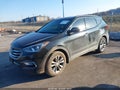 2018 Hyundai Santa Fe — photo 2 of 16 | VIN 5XYZUDLA4JG543645