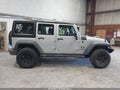 2009 Jeep Wrangler Unlimited — photo 13 of 18 | VIN 1J4GA39179L771487