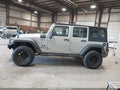 2009 Jeep Wrangler Unlimited — photo 14 of 18 | VIN 1J4GA39179L771487