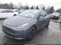 2023 Tesla Model Y — photo 2 of 17 | VIN 7SAYGAEE5PF941919