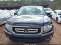 2011 Honda Ridgeline — photo 12 of 16 | VIN 5FPYK1F47BB004278