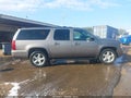 2011 Chevrolet Suburban 1500 — photo 13 of 16 | VIN 1GNSCJE09BR138348