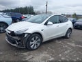 2022 Tesla Model Y — photo 2 of 24 | VIN 7SAYGAEE2NF570912