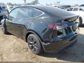 2025 Tesla Model Y — photo 3 of 18 | VIN 7SAYGDED5SF227130