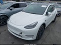 2025 Tesla Model Y — photo 2 of 23 | VIN 7SAYGDED8SF260185