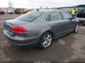 2014 Volkswagen Passat — photo 4 of 18 | VIN 1VWCN7A3XEC018279