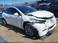 2023 Tesla Model Y — photo 1 of 16 | VIN 7SAYGDEE7PA126961
