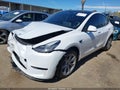 2023 Tesla Model Y — photo 2 of 16 | VIN 7SAYGDEE7PA126961