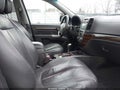2012 Hyundai Santa Fe — photo 5 of 11 | VIN 5XYZK4AG4CG106647