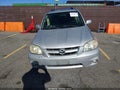 2005 Mazda Tribute — photo 11 of 15 | VIN 4F2CZ06135KM35450