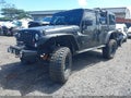 2014 Jeep Wrangler Unlimited — photo 2 of 18 | VIN 1C4BJWDG3EL258017