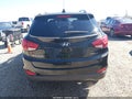 2014 Hyundai Tucson — photo 16 of 17 | VIN KM8JU3AGXEU797522