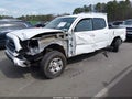 2016 Toyota Tacoma — photo 2 of 16 | VIN 3TMDZ5BN4GM004167