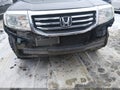 2012 Honda Pilot — photo 13 of 15 | VIN 5FNYF4H20CB005980