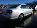 2010 Volkswagen Jetta — photo 4 of 12 | VIN 3VWRL7AJXAM084872