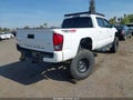 2018 Toyota Tacoma — photo 4 of 21 | VIN 3TMDZ5BN0JM039991