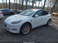 2021 Tesla Model Y — photo 2 of 17 | VIN 5YJYGDEE8MF304887