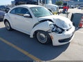 2014 Volkswagen Beetle — photo 1 of 17 | VIN 3VWJP7AT8EM615334