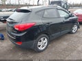 2012 Hyundai Tucson — photo 4 of 17 | VIN KM8JUCACXCU417704