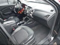 2012 Hyundai Tucson — photo 5 of 17 | VIN KM8JUCACXCU417704