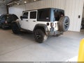 2014 Jeep Wrangler Unlimited — photo 3 of 18 | VIN 1C4BJWDG0EL225850
