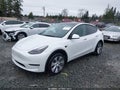 2023 Tesla Model Y — photo 2 of 20 | VIN 7SAYGDEE8PF816186