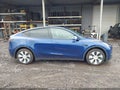 2023 Tesla Model Y — photo 13 of 18 | VIN 7SAYGDEE0PF770305