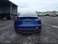 2023 Tesla Model Y — photo 16 of 18 | VIN 7SAYGDEE0PF770305