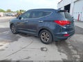 2016 Hyundai Santa Fe — photo 3 of 16 | VIN 5XYZU3LB1GG376138